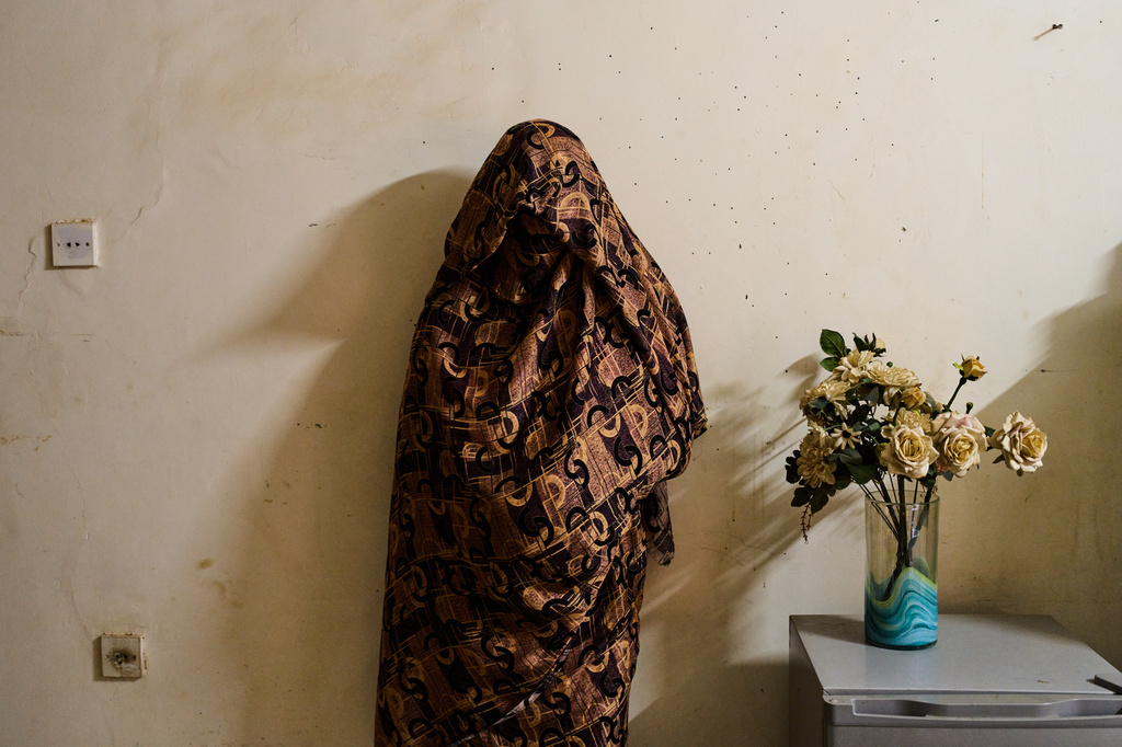 A 50-year-old woman who said she was abducted and sexually assaulted for four months by the Rapid Support Forces, or RSF, before escaping, poses for a portrait after an interview with The Associated Press in Omdurman, on the outskirts of Khartoum, Sudan, Sunday, April 19, 2026. (AP Photo/Bernat Armangue)