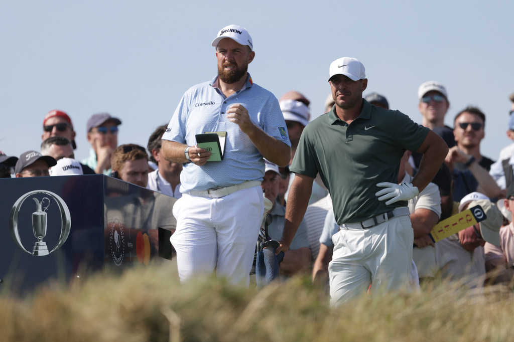 Shane Lowry of Ireland, left ,and Brooks Koepka of the United States wait to play on the 7th tee during the first day of the British Open Golf championships at Royal Birkdale golf club, in Southport, England, Thursday, July 16, 2026. (AP Photo/Peter Morrison)
