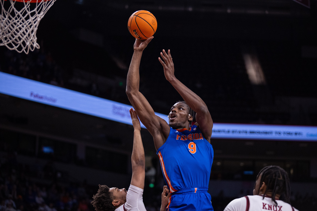 Florida Gators center Rueben Chinyelu (9) shoots against the South Carolina during the first half of an NCAA college basketball game Wednesday, Jan. 28, 2026, in Columbia, S.C. (AP Photo/Scott Kinser)