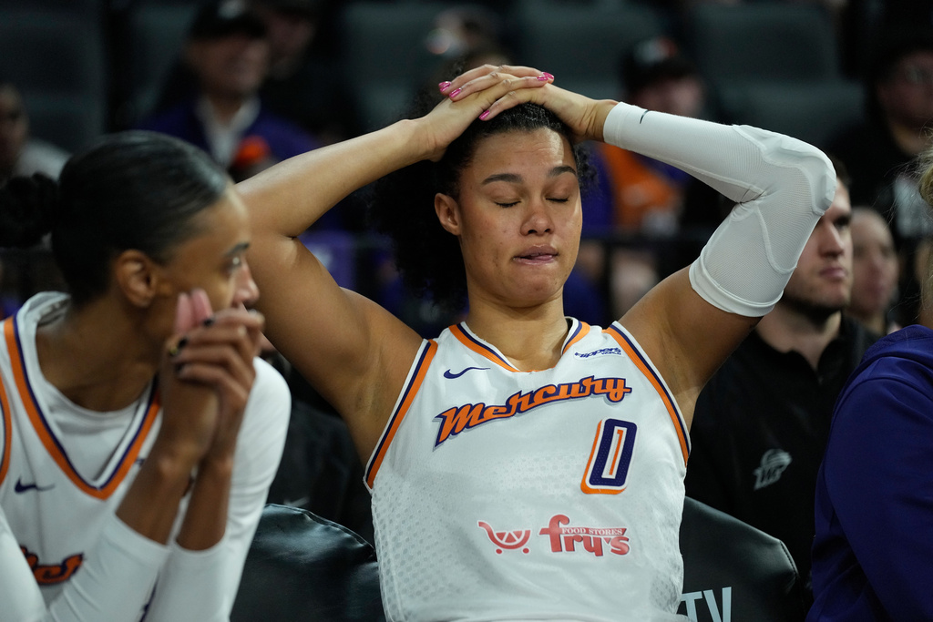 Phoenix Mercury forward Satou Sabally (0) sits on the bench during the second half in Game 2 of the WNBA basketball finals against the Las Vegas Aces, Sunday, Oct. 5, 2025, in Las Vegas. (AP Photo/John Locher)