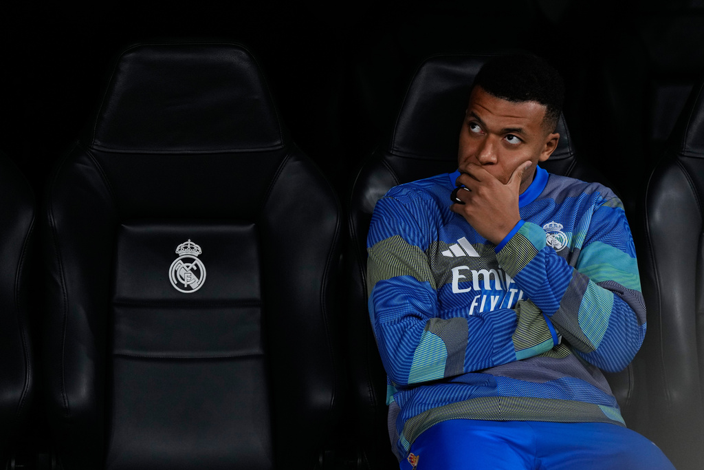 Real Madrid's Kylian Mbappe sits at the bench before a Champions League opening phase soccer match between Real Madrid and Manchester City, in Madrid, Spain, Wednesday, Dec. 10, 2025. (AP Photo/Manu Fernandez)
