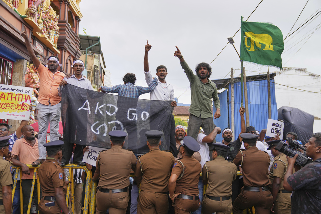 Supporters of former president of Sri Lanka Ranil Wickremesinghe celebrate after a court granted him bail, in Colombo, Sri Lanka, Tuesday, Aug. 26, 2025. (AP Photo/Eranga Jayawardena)