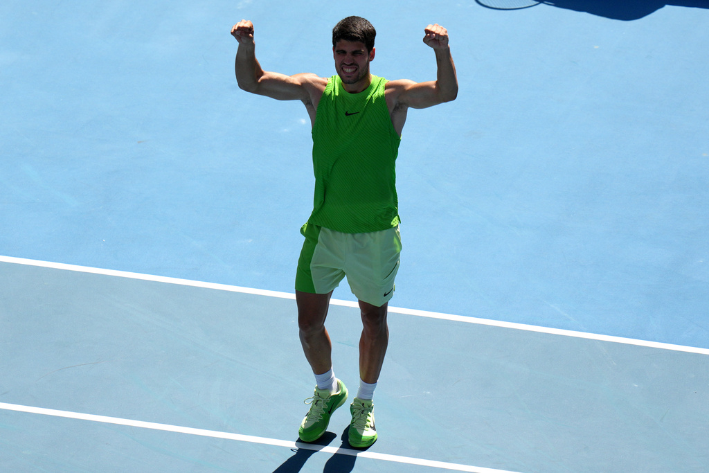 Carlos Alcaraz of Spain celebrates after defeating Tommy Paul of the U.S. during their fourth round match at the Australian Open tennis championship in Melbourne, Australia, Sunday, Jan. 25, 2026. (AP Photo/Dar Yasin)