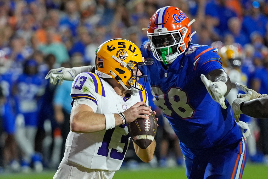 FILE - Florida defensive lineman Caleb Banks (88) sacks LSU quarterback Garrett Nussmeier (13) during the second half of an NCAA college football game, Saturday, Nov. 16, 2024, in Gainesville, Fla. (AP Photo/John Raoux, File)
