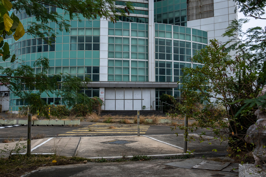 The exterior of the now lying idle building of former Apple Daily in Hong Kong, Jan. 30, 2026. (AP Photo/Chan Long Hei)