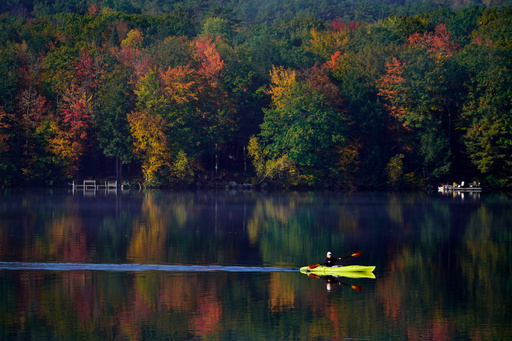 FILE - Virginia Davidson of Bridgton, Maine, paddles her kayak on Moose Pond, Oct. 13, 2021, in Bridgton, Maine. (AP Photo/Robert F. Bukaty) FILE - Virginia Davidson of Bridgton, Maine, paddles her kayak on Moose Pond, Oct. 13, 2021, in Bridgton, Maine. (AP Photo/Robert F. Bukaty)