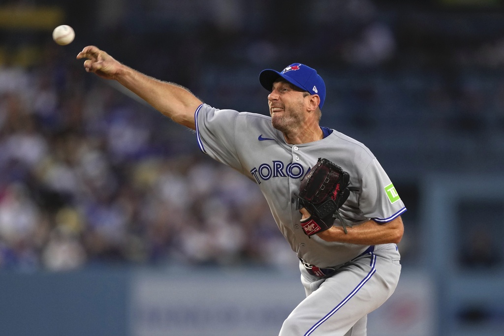 Toronto Blue Jays starting pitcher Max Scherzer throws to the plate during the second inning of a baseball game against the Los Angeles Dodgers, Friday, Aug. 8, 2025, in Los Angeles. (AP Photo/Mark J. Terrill)