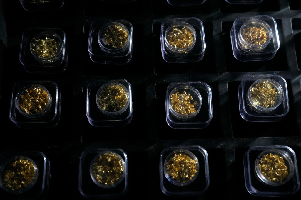 Gold samples seized during federal police investigations are displayed at the National Institute of Criminalistics in Brasilia, Brazil, Monday, July 13, 2026. (AP Photo/Eraldo Peres)