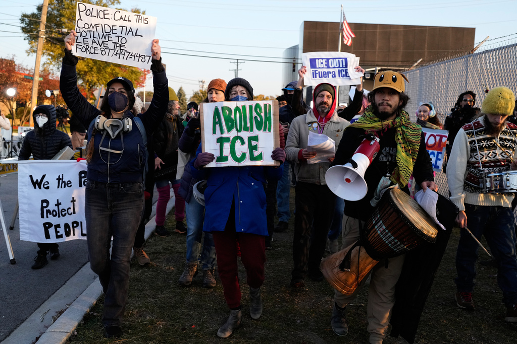 Protesters gather outside an ICE processing facility in the Chicago suburb of Broadview, Ill., Friday, Oct. 31, 2025. (AP Photo/Nam Y. Huh)