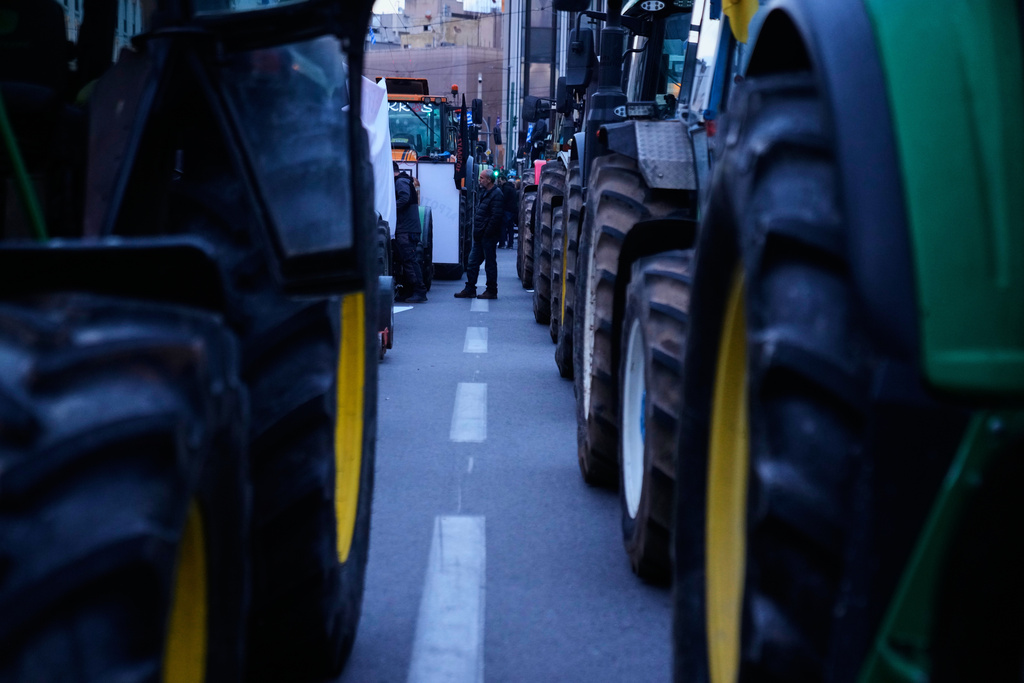 Farmers park their tractors in front of the Greek parliament as they protesting against high production costs, low prices for their products and delays in subsidy payments, in central Athens, on Friday, Feb. 13, 2026. (AP Photo/Petros Giannakouris)