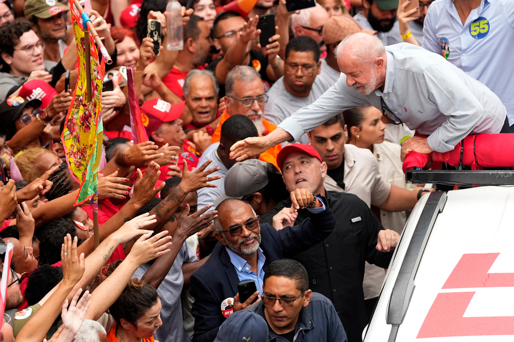 Brazilian President Luiz Inacio Lula da Silva, who is running for reelection, greets supporters during a campaign rally in Rio de Janeiro, Brazil, Friday, Oct. 2, 2026. (AP Photo/Silvia Izquierdo)