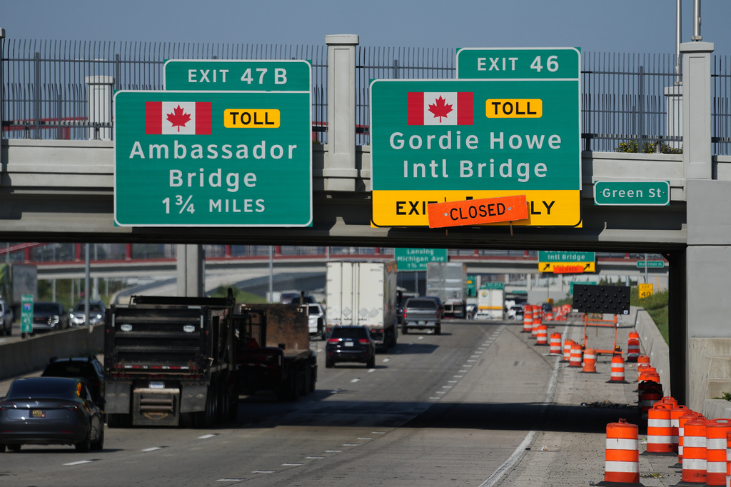 Exits from Interstate 75 are displayed for the Gordie Howe International Bridge and Ambassador Bridge connecting Windsor, Ontario, with Detroit, Tuesday, July 14, 2026, (AP Photo/Paul Sancya)