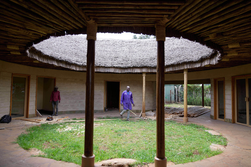 A contractor takes measurements inside a house under construction, inspecting wall and roof insulation made from agricultural waste and mushroom mycelium in Nairobi, Kenya, Friday, Sept. 12, 2025. (AP Photo/Brian Inganga) A contractor takes measurements inside a house under construction, inspecting wall and roof insulation made from agricultural waste and mushroom mycelium in Nairobi, Kenya, Friday, Sept. 12, 2025. (AP Photo/Brian Inganga)
