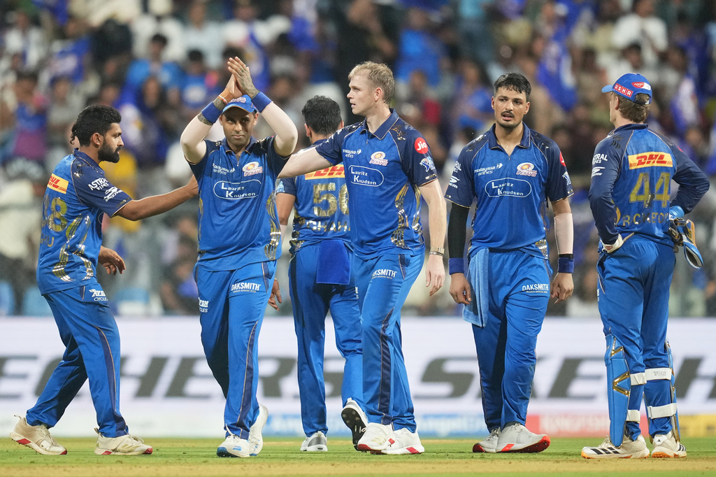 Mumbai Indians' Corbin Bosch celebrates with teammates the wicket of Lucknow Super Giants' Mitchell Marsh during the Indian Premier League cricket match between Mumbai Indians and Lucknow Super Giants in Mumbai, India, Monday, May 4, 2026.(AP Photo/Rafiq Maqbool)