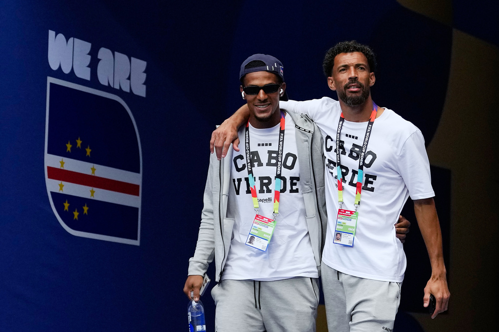 Cape Verde goalkeepers Vozinha, right, and Marcio Rosa walk onto the pitch for a team visit on the eve of their Group H World Cup match against Uruguay, in Miami Gardens, Fla., Saturday, June 20, 2026. (AP Photo/Rebecca Blackwell)