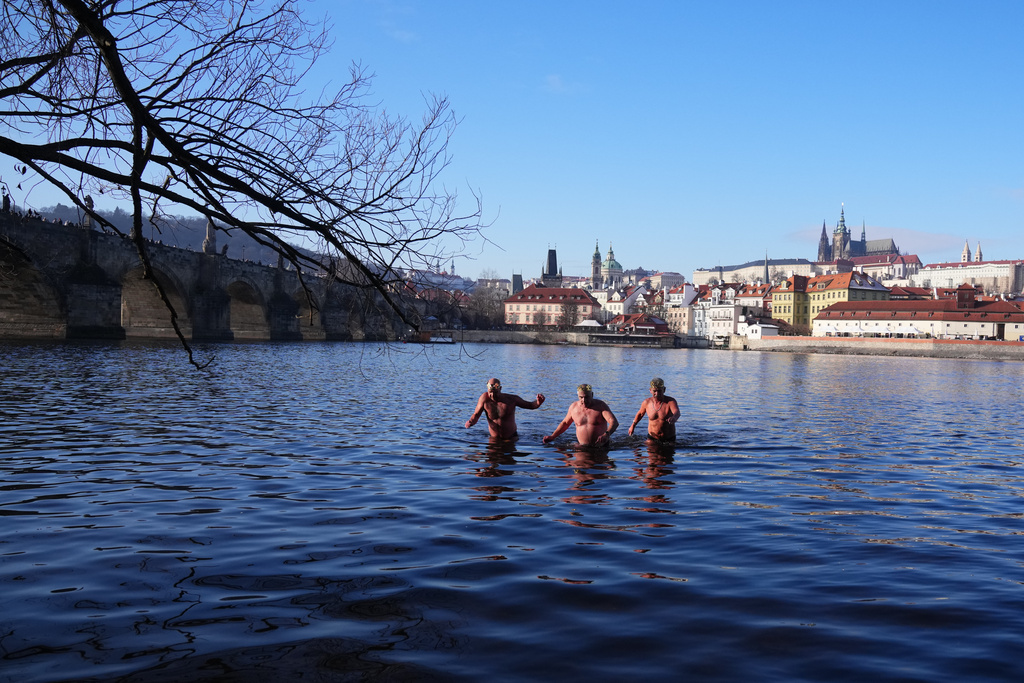 Polar swimmers take part in their traditional Three Kings swim in the Vltava River in Prague, Czech Republic, Tuesday, Jan. 6, 2026. (AP Photo/Petr David Josek)