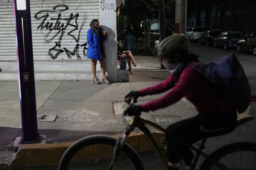 Montserrat Fuentes stands on Calzada de Tlalpan where she has worked as a sex worker for 20 years and the city is building a new bike lane ahead of the World Cup soccer tournament, blocking cars from pulling over and closing the metro at night, in Mexico City, Friday, Jan. 30, 2026. (AP Photo/Eduardo Verdugo)