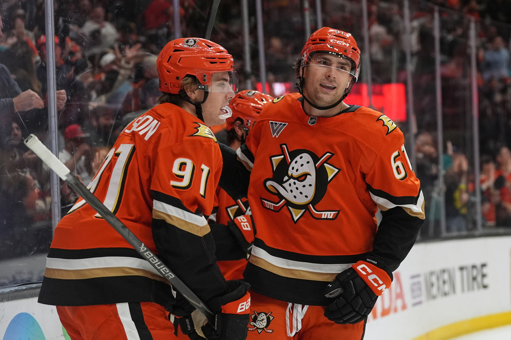 Anaheim Ducks left wing Cutter Gauthier (61) celebrates his goal with teammate center Leo Carlsson during the first period of an NHL hockey game against the New York Islanders Wednesday, March 4, 2026, in Anaheim, Calif. (AP Photo/Gregory Bull)