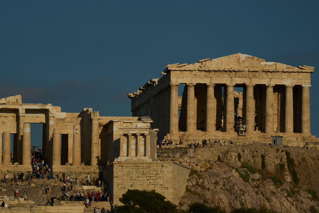 The 5th century B.C. Parthenon temple, right stands free of scaffolding on the Acropolis hill in Athens, Friday, Oct. 10, 2025, after the removal of restoration structures that had covered parts of the ancient monument for decades.(AP Photo/Petros Giannakouris)