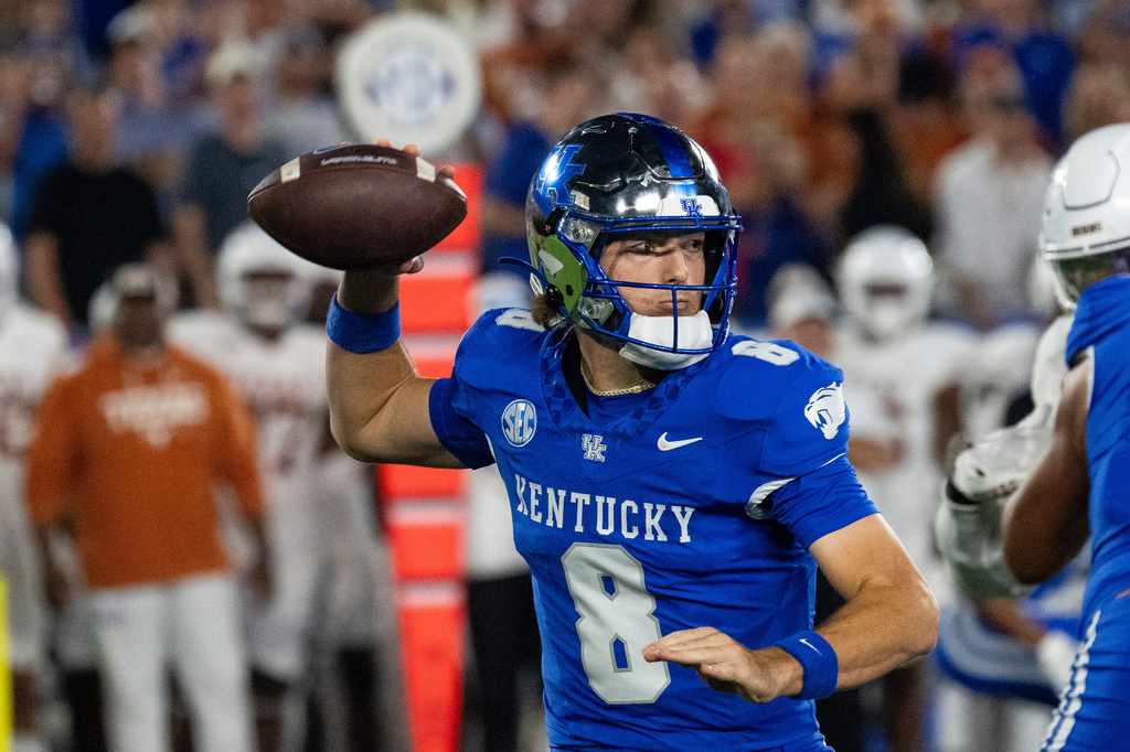 Kentucky quarterback Cutter Boley (8) drops back for a pass in the second quarter of an NCAA college football game against Texas, Saturday, Oct. 18, 2025, in Lexington, Ky. (AP Photo/Michael Swensen)