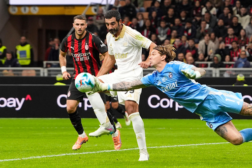 Pisa's goalkeeper Adrian Šemper, right, dives out to make a save as defender Raúl Albiol, center, backs up the play during the Serie A soccer match between AC Milan and Pisa in Milan, Italy, Friday, Oct. 24, 2025. (Fabio Ferrari /LaPresse via AP) Pisa's goalkeeper Adrian Šemper, right, dives out to make a save as defender Raúl Albiol, center, backs up the play during the Serie A soccer match between AC Milan and Pisa in Milan, Italy, Friday, Oct. 24, 2025. (Fabio Ferrari /LaPresse via AP)