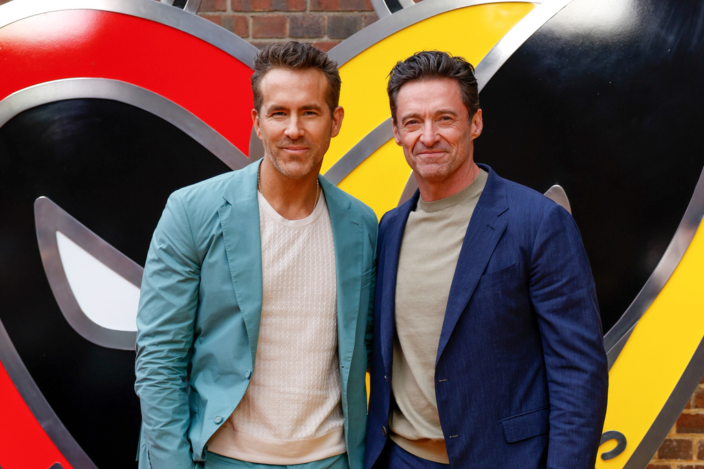 FILE - Ryan Reynolds, left, and Hugh Jackman pose for photographers upon arrival at the screening of the film "Deadpool & Wolverine" on July 11, 2024 in London. (Photo by Millie Turner/Invision/AP, File)