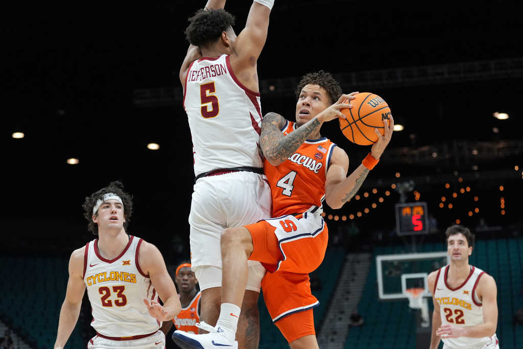 Syracuse guard Nate Kingz (4) drives to the basket against Iowa State forward Joshua Jefferson (5) during the second half of an NCAA college basketball game in the Players Era tournament in Las Vegas, Wednesday, Nov. 26, 2025. (AP Photo/Eric Gay)
