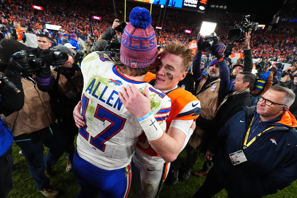 Buffalo Bills quarterback Josh Allen (17) greets Denver Broncos quarterback Bo Nix (10) after an NFL divisional round playoff football game, Saturday, Jan. 17, 2026, in Denver. (AP Photo/Jack Dempsey)