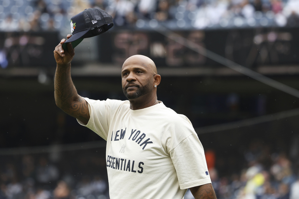 CC Sabathia acknowledges the crowd during a ceremony honoring him for his Baseball Hall of Fame induction before a baseball game between the Toronto Blue Jays and New York Yankees, Sunday, Sept. 7, 2025, in New York. (AP Photo/Heather Khalifa)