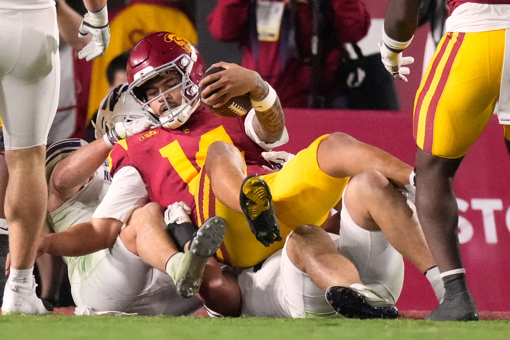Southern California quarterback Jayden Maiava dives in for a touchdown during the first half of an NCAA college football game against Northwestern, Friday, Nov. 7, 2025, in Los Angeles. (AP Photo/Mark J. Terrill)