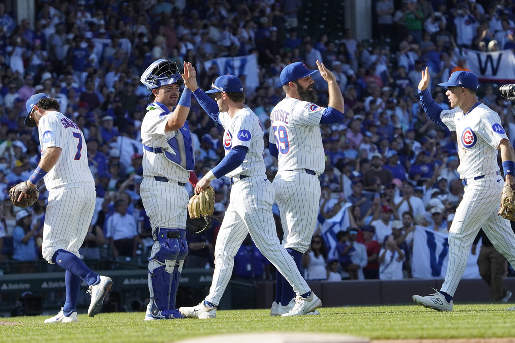 The Chicago Cubs celebrate their win against the Tampa Bay Rays in a baseball game Sunday, Sept. 14, 2025, in Chicago. (AP Photo/David Banks)