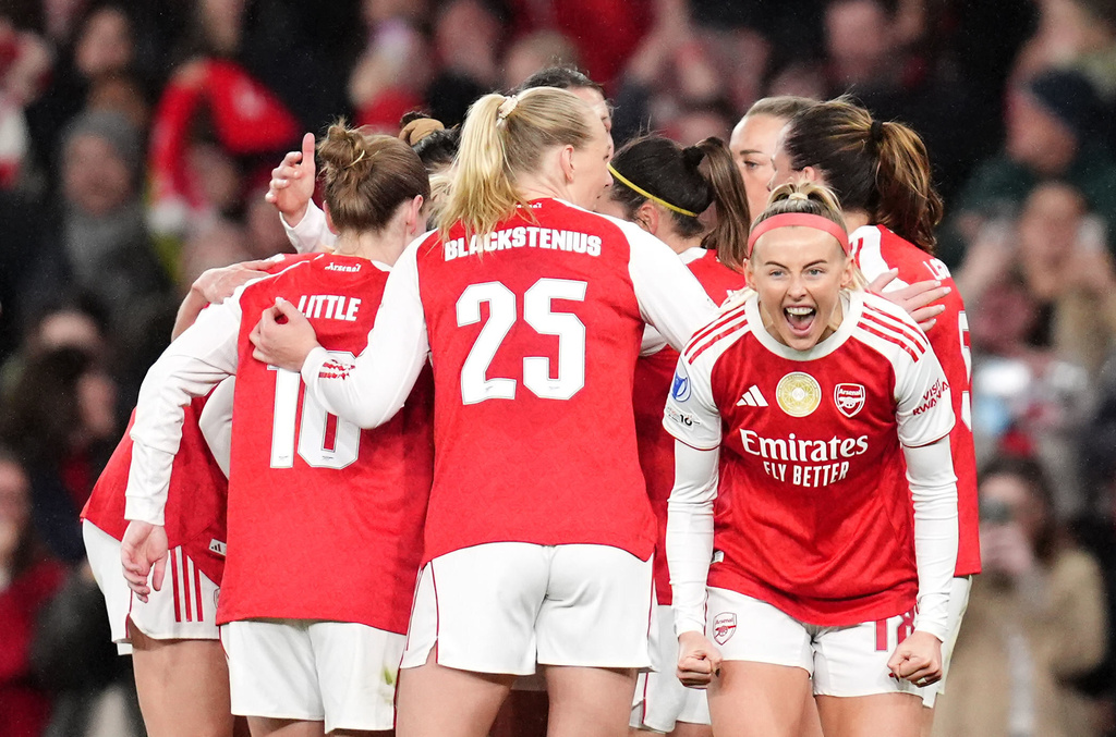 Arsenal's Chloe Kelly, right, celebrates scoring their side's second goal of the game with team-mates during the Women's Champions League soccer match between Arsenal and Chelsea in London, Tuesday, March 24, 2026. (John Walton/PA via AP)