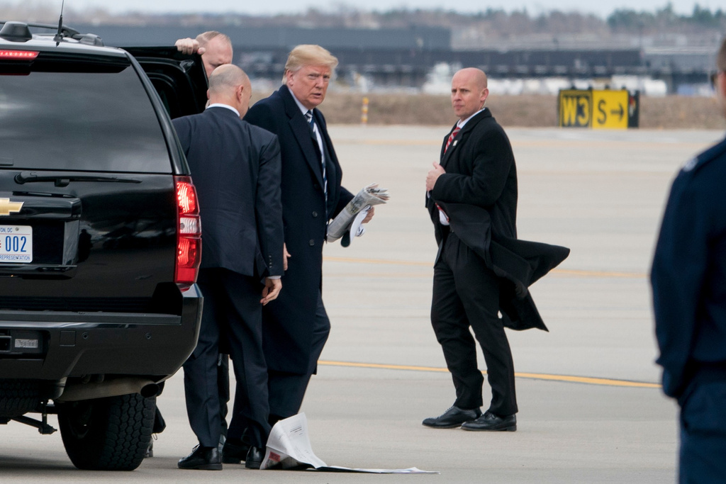 FILE - President Donald Trump boards Air Force One at Dulles International Airport in Dulles, Va., March 2, 2018. (AP Photo/Andrew Harnik, File)