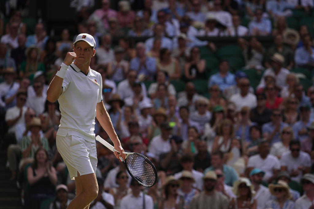 Jannik Sinner of Italy celebrates a point against Novak Djokovic of Serbia in their men's singles semifinal match at the Wimbledon Tennis Championships in London, Friday, July 10, 2026. (AP Photo/Brian Inganga)