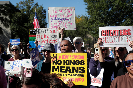 Demonstrators hold signs during a rally protesting a proposed election redistricting map Tuesday, Oct. 21, 2025, in Raleigh, N.C. (AP Photo/Chris Seward) Demonstrators hold signs during a rally protesting a proposed election redistricting map Tuesday, Oct. 21, 2025, in Raleigh, N.C. (AP Photo/Chris Seward)