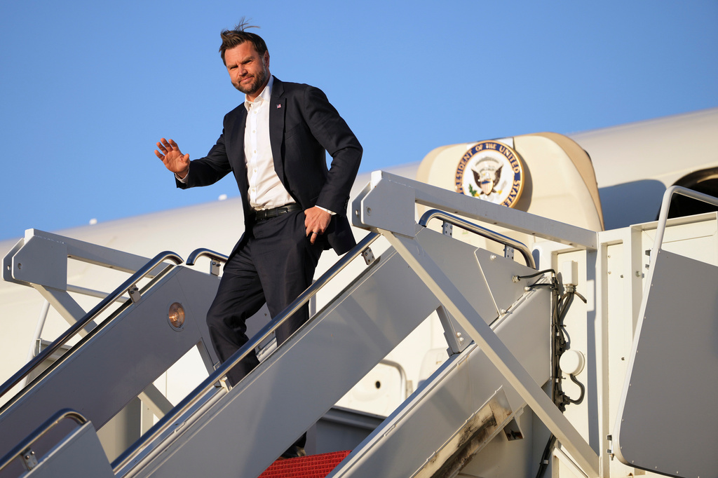 Vice President JD Vance waves as he arrives on Air Force Two, Monday, Sept. 14, 2026, at Joint Base Andrews, Md. (AP Photo/Mark Schiefelbein, Pool)