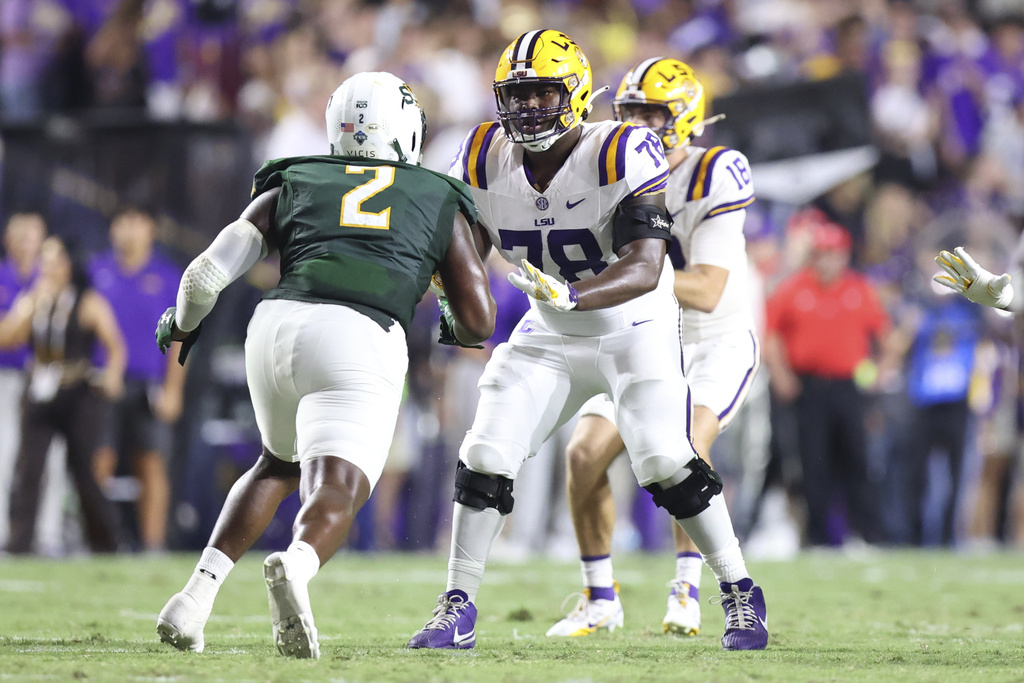 LSU offensive lineman Coen Echols (78) blocks Southeastern Louisiana defensive lineman Kaleb Proctor (2) in the first half of an NCAA college football game in Baton Rouge, La., Saturday, Sept. 20, 2025. (AP Photo/Peter Forest)