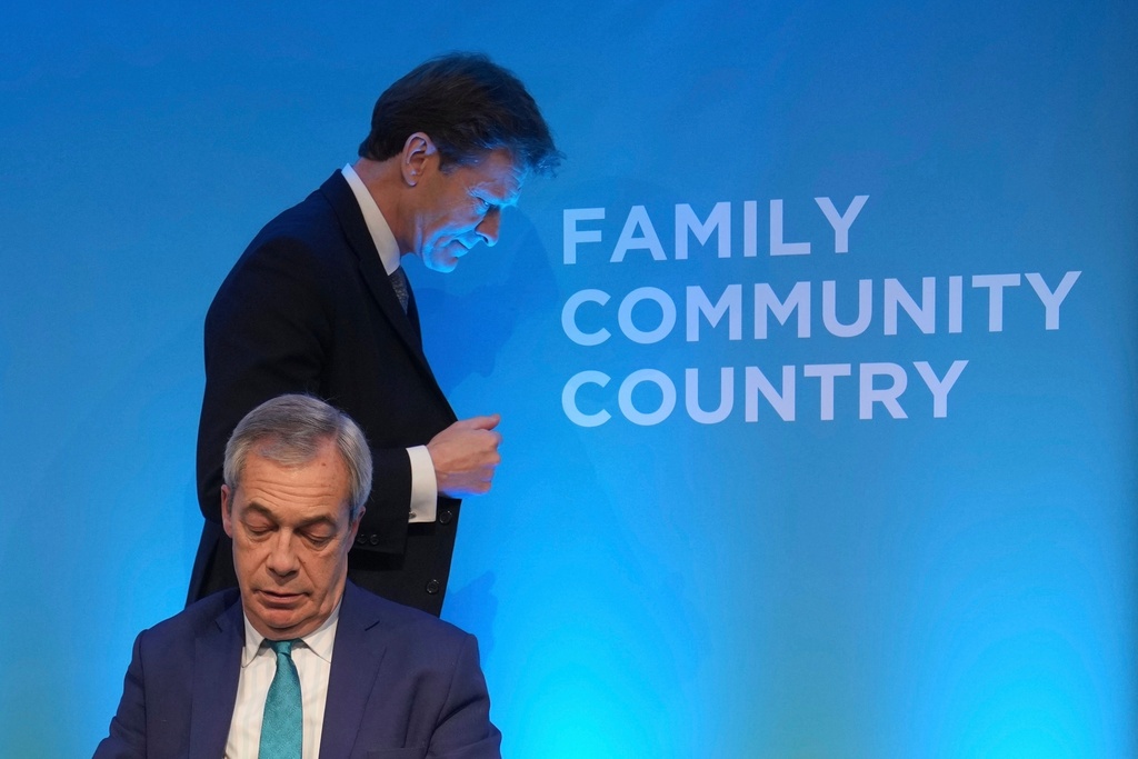 FILE - Reform UK leader Nigel Farage, front, and deputy leader Richard Tice attend a news conference on the economy and renewable energy, in London, Wednesday, Feb. 12, 2025. (AP Photo/Kin Cheung, File)