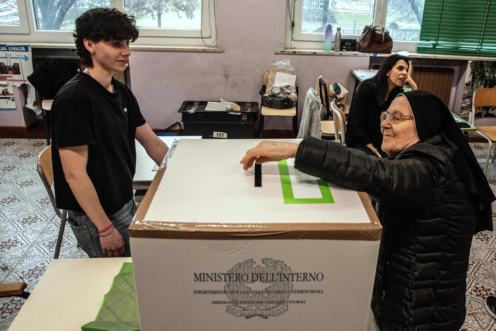 A nun votes in a referendum on judicial reform, at a polling station in Turin, Italy, Sunday March 22, 2026. (Daniele Solavaggione/LaPresse via AP)