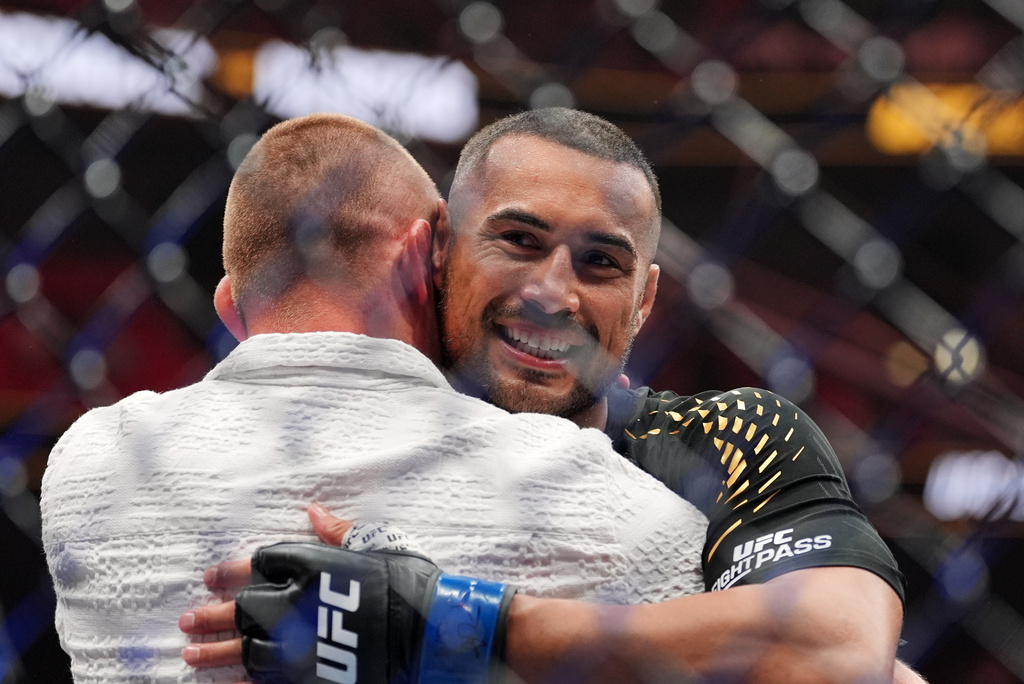 Carlos Ulberg, of New Zealand, reacts after defeating Jiri Prochazka, of Czechia, by TKO to win their light heavyweight title bout at a UFC 327 mixed martial arts event, Saturday, April 11, 2026, in Miami. (AP Photo/Rebecca Blackwell)