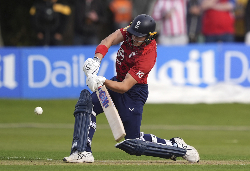England's Jacob Bethell hits for six during the First Men's International Twenty20 match between Ireland and England, at Malahide Cricket Club in Dublin, Ireland, Wednesday Sept. 17, 2025. (Brian Lawless/PA via AP)