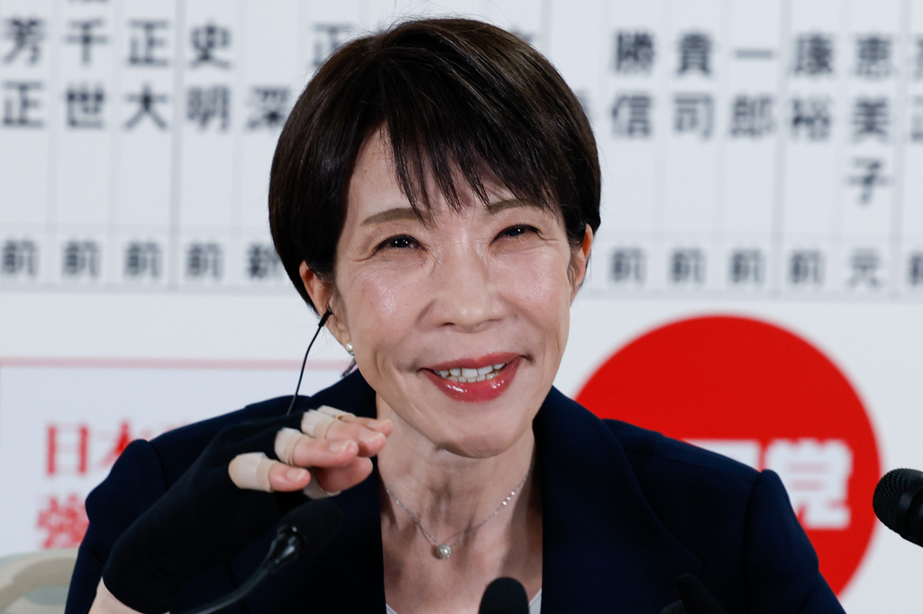 Japan's Prime Minister Sanae Takaichi, leader of the ruling Liberal Democratic Party (LDP), gives an interview with local media in front of a board displaying the names of LDP candidates, at the LDP headquarters Sunday, Feb. 8, 2026 in Tokyo. (Kim Kyung-Hoon/Pool Photo via AP)