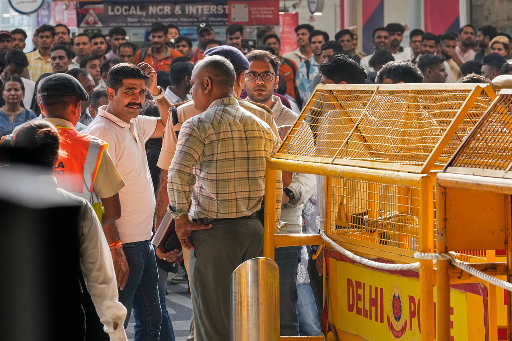 Saurabh Das, center, spokesperson of Cockroach Janta Party waits for the arrival of Abhijeet Dipke, founder of CJP at Indira Gandhi International airport in New Delhi, India, Saturday, June 6, 2026. (AP Photo/Manish Swarup)