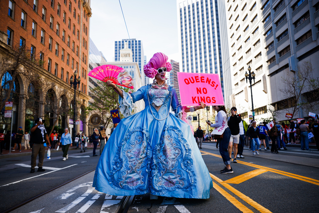 Drag queen Dirty Carol joins the third "No Kings" day event at Embarcadero Plaza before marching to Civic Center Plaza in San Francisco on Saturday, March 28, 2026. (Yalonda M. James/San Francisco Chronicle via AP)