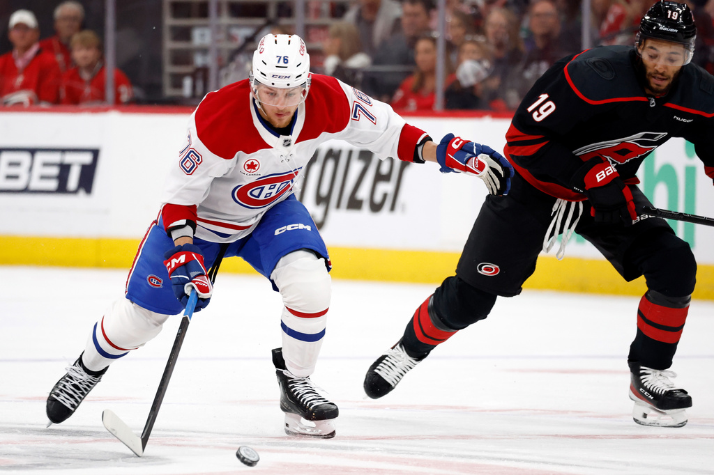 Montreal Canadiens' Zachary Bolduc (76) controls the puck near Carolina Hurricanes' K'andre Miller (19) during the first period in Game 5 of the Eastern Conference finals NHL hockey Stanley Cup playoff series in Raleigh, N.C., Friday, May 29, 2026. (AP Photo/Karl DeBlaker)