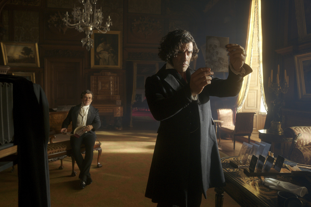 This image released by Netflix shows Christoph Waltz, left, and Oscar Isaac in a scene from "Frankenstein." (Netflix via AP)