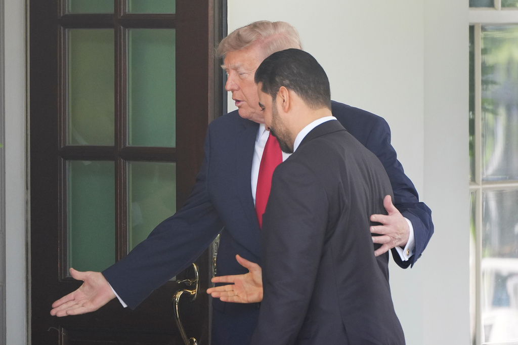 President Donald Trump with Iraq's Prime Minister Ali al-Zaidi as they walk into the White House together, Tuesday, July 14, 2026, in Washington.(AP Photo/Alex Brandon)