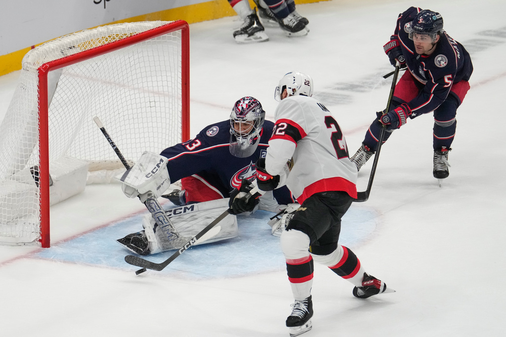 Ottawa Senators right wing Michael Amadio (22) shoots on Columbus Blue Jackets goaltender Jet Greaves (73) in the first period of an NHL hockey game Thursday, Dec. 11, 2025, in Columbus, Ohio. (AP Photo/Sue Ogrocki)