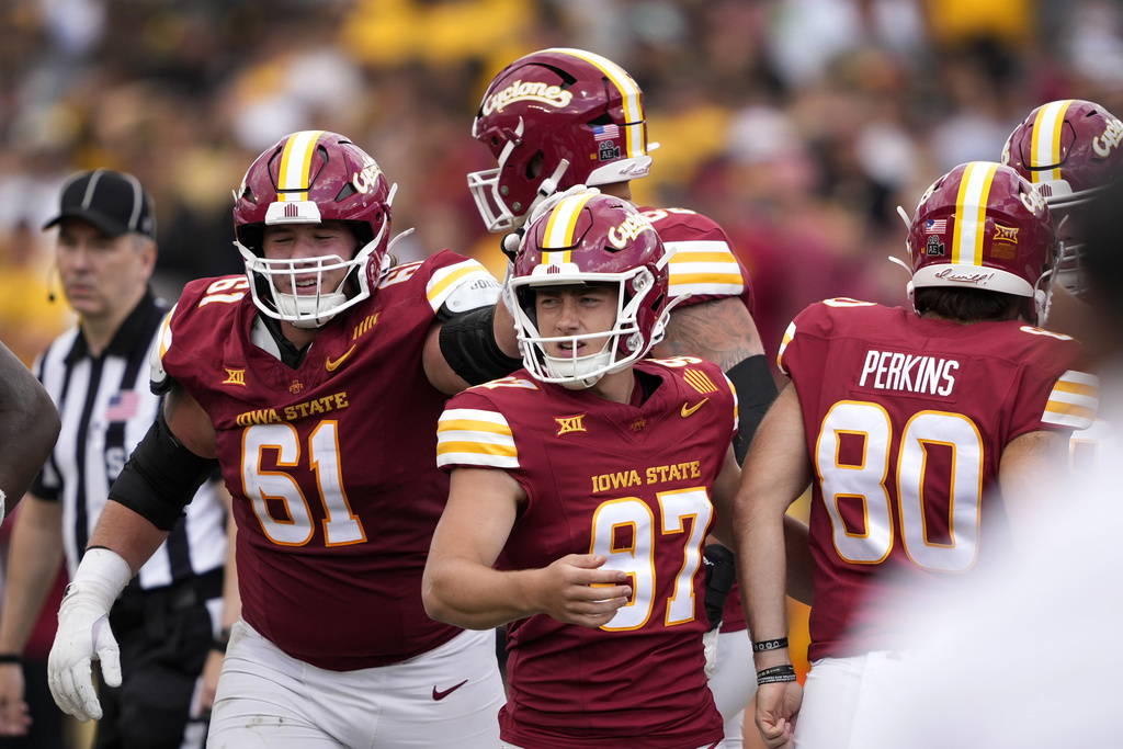 Iowa State place kicker Kyle Konrardy (97) celebrates with teammates after kicking a field goal during the second half of an NCAA college football game against Iowa, Saturday, Sept. 6, 2025, in Ames, Iowa. (AP Photo/Charlie Neibergall)