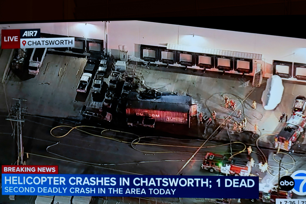 In this still image provided by KABC-TV shows First responders work the scene after a helicopter crashed near a bus crash in Chatsworth, a neighborhood in Los Angeles, Tuesday, Sept. 15, 2026. (KABC-TV via AP)